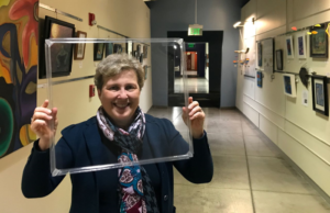WexEnergy CEO Rachel Rosen holds up a WindowSkin® to demonstrate its transparency and light weight. The company received a third place $10,000 non-equity prize during the DeltaClimeVT Energy 2020 virtual awards ceremony. Photo courtesy of WexEnergy. 