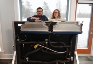 Neothermal Energy Storage co-founders Louis Desgrosseilliers and Jill Johnson with a very early lab prototype ETS system used to evaluate the various component interactions. Photo courtesy of the Nova Scotia Community College.