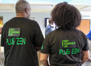 DeltaClimeVT Energy 2023 Plug Zen LLC shows off their light-up shirts. Photo courtesy of Vermont Sustainable Jobs Fund.